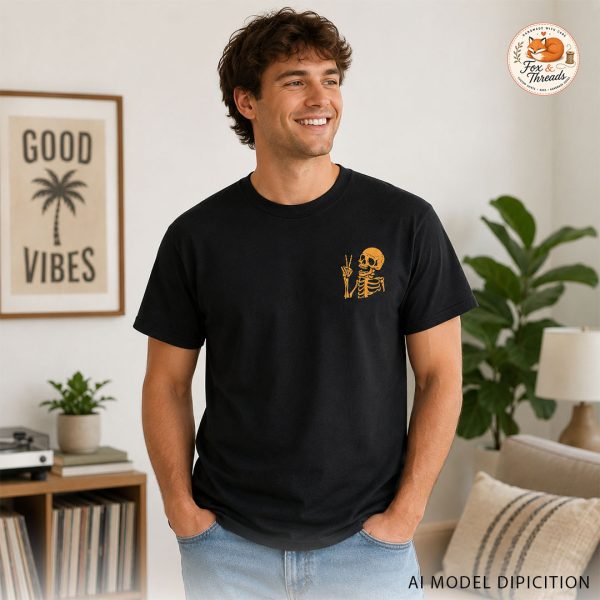 Model wearing black skeleton graphic tee with small front chest design