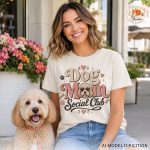 Woman wearing Dog Mom Social Club graphic tee while sitting with her dog
