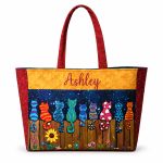 Personalized cats on a fence quilted tote bag front view