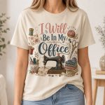 I Will Be In My Office sewing shirt on Sand Softstyle t-shirt