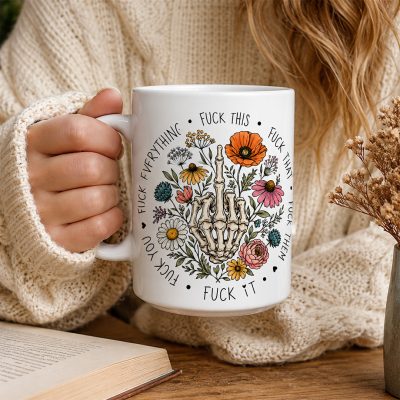 Woman in a sweater holding a sarcastic coffee mug