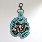 DCC inspired Special Boy embroidered goat key fob on aqua vinyl