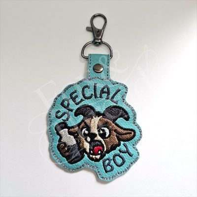 DCC inspired Special Boy embroidered goat key fob on aqua vinyl