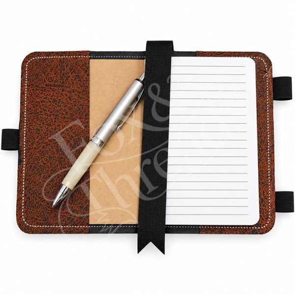 Open embroidered notebook cover with lined notebook, pen holder and interior pocket