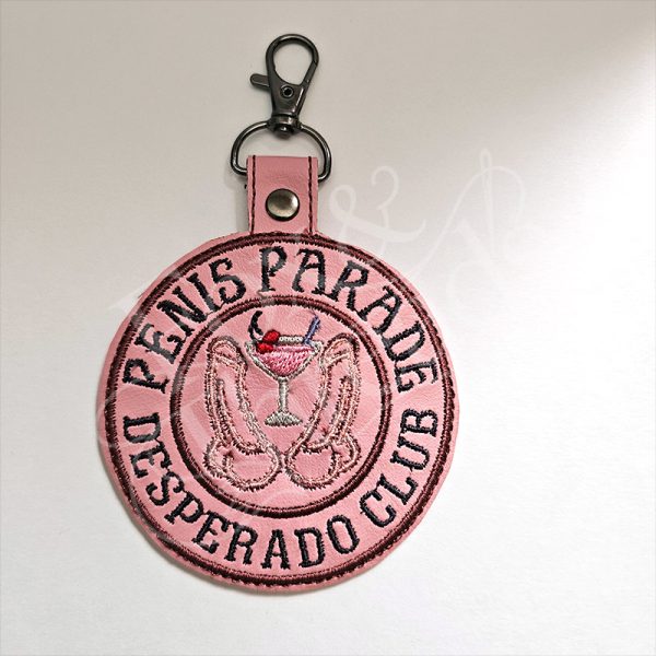 DCC inspired Penis Parade Desperado Club embroidered key fob on dusty pink vinyl