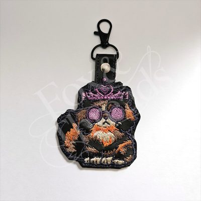Princess Donut DCC inspired embroidered key fob with crown and purple sunglasses