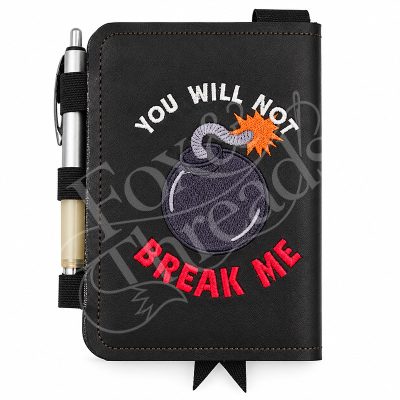 You Will Not Break Me embroidered DCC notebook cover with bomb design